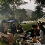 Camping group gathering for dinner at the Coolendel campsite as the evening begins